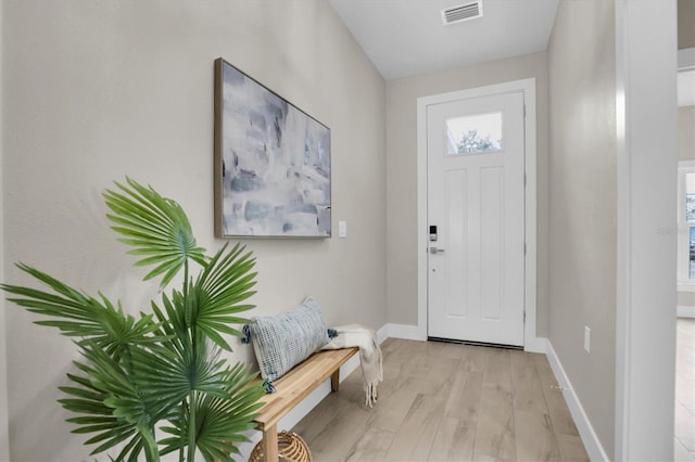 entryway with a wealth of natural light and light wood-type flooring