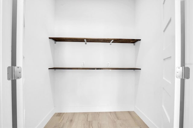 walk in closet featuring light wood-type flooring