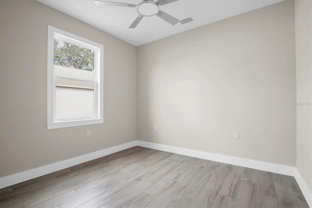 unfurnished room with light hardwood / wood-style flooring and ceiling fan