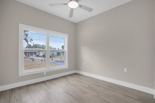 unfurnished room featuring ceiling fan and light wood-type flooring