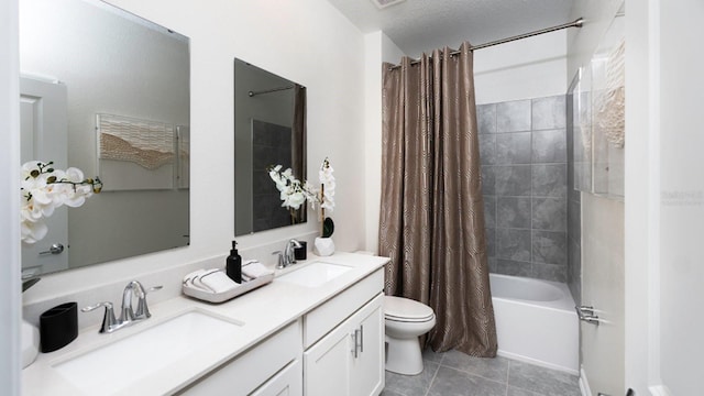 full bathroom featuring vanity, tile patterned floors, toilet, shower / bathtub combination with curtain, and a textured ceiling