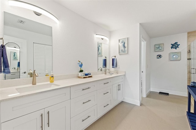 bathroom featuring vanity and an enclosed shower