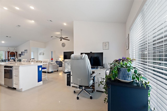 office space with ceiling fan, lofted ceiling, and sink