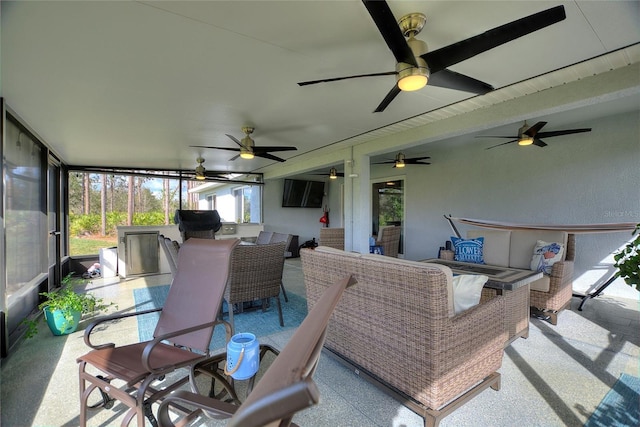 view of patio / terrace featuring area for grilling and ceiling fan