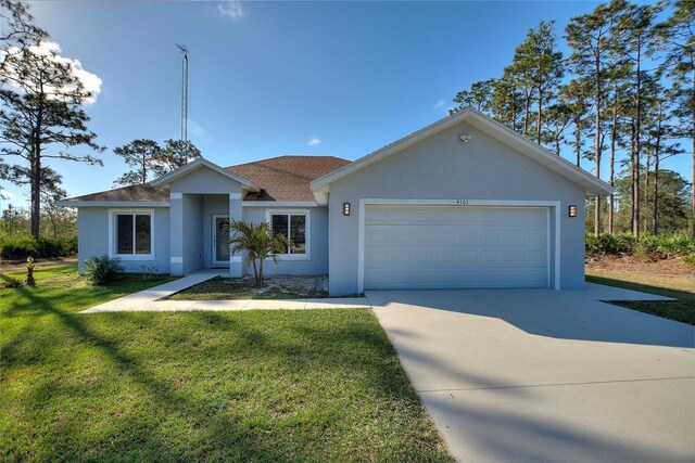 ranch-style house with a garage and a front yard