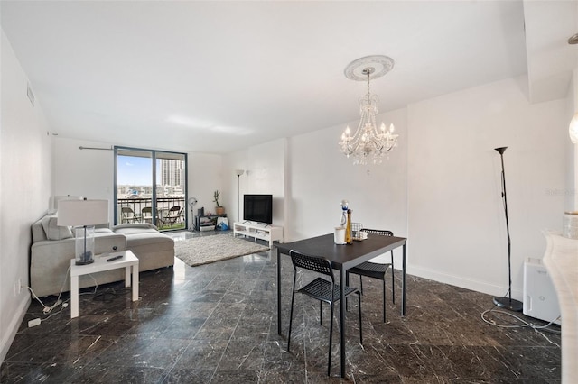 dining area with a notable chandelier