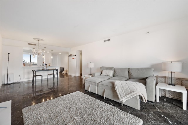 living room featuring an inviting chandelier