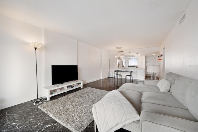 living room featuring an inviting chandelier