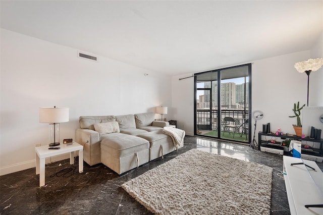 living room featuring floor to ceiling windows