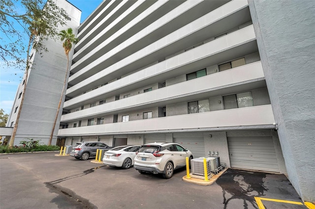 view of building exterior with central AC unit