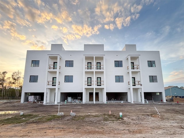 view of outdoor building at dusk