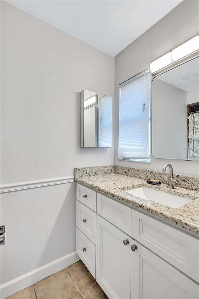 bathroom with vanity and tile patterned floors