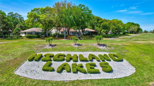 view of home's community with a lawn