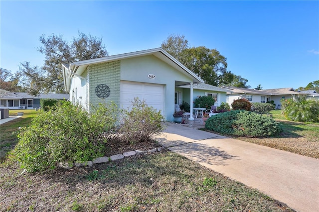 ranch-style house featuring a garage