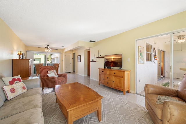 tiled living room featuring ceiling fan