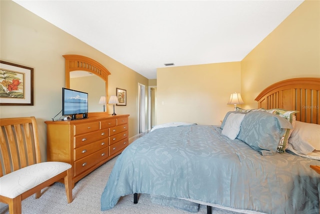 bedroom with light colored carpet