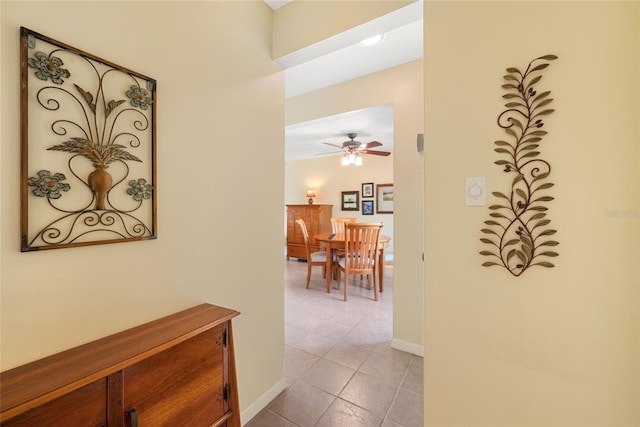 hall featuring light tile patterned flooring