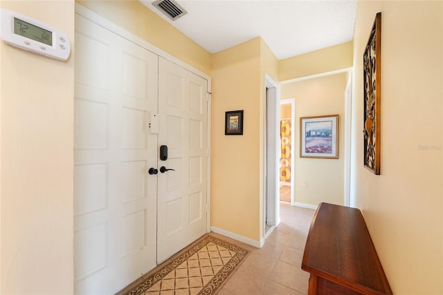 view of tiled foyer entrance