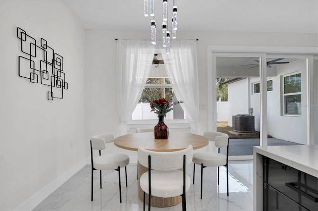 dining space with ceiling fan