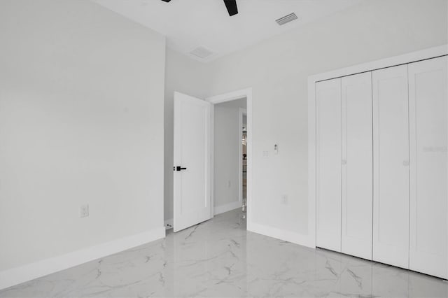 unfurnished bedroom with a closet and ceiling fan