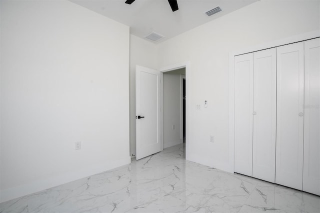 unfurnished bedroom with a closet and ceiling fan