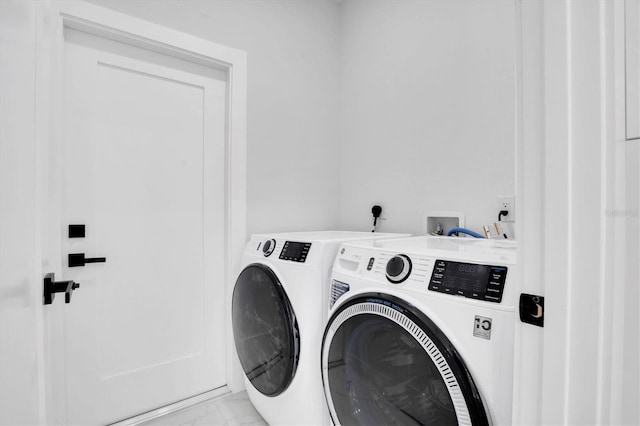 clothes washing area with independent washer and dryer