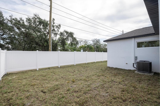 view of yard with central AC