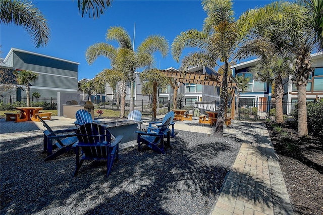 exterior space featuring an outdoor bar, a patio, and an outdoor kitchen