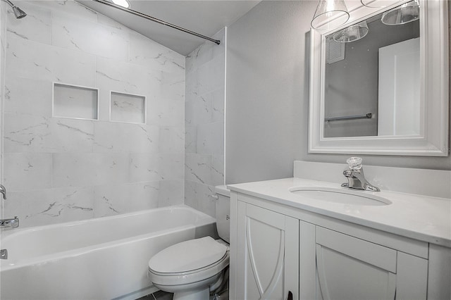 full bathroom with toilet, vanity, and tiled shower / bath combo