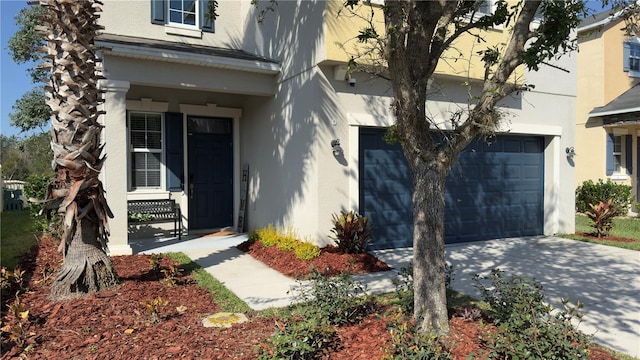 doorway to property with a garage