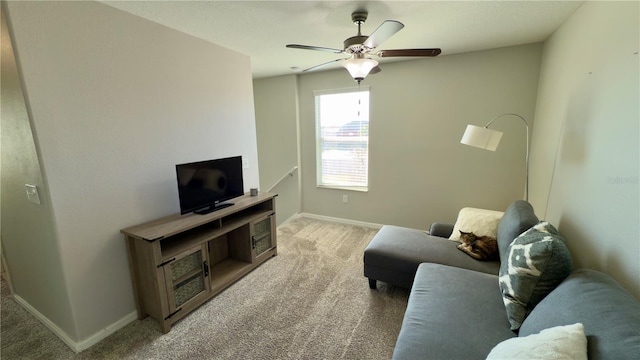 living room with ceiling fan and carpet floors