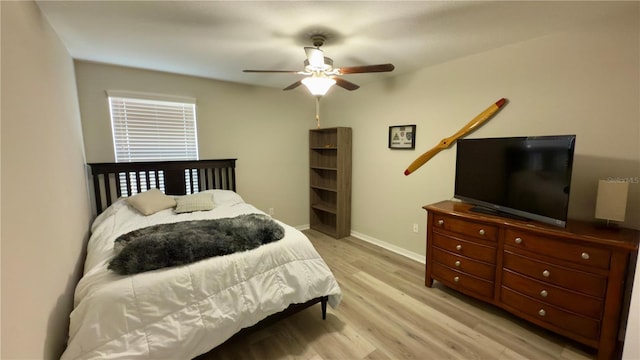 bedroom featuring ceiling fan and light hardwood / wood-style flooring