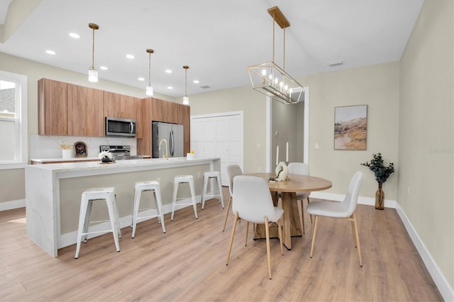 dining room featuring light wood-type flooring