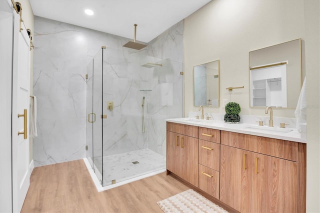 bathroom featuring vanity, hardwood / wood-style floors, and an enclosed shower