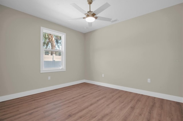 spare room featuring ceiling fan and light wood-type flooring