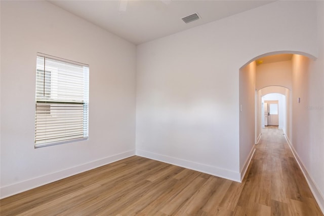 empty room with light hardwood / wood-style floors