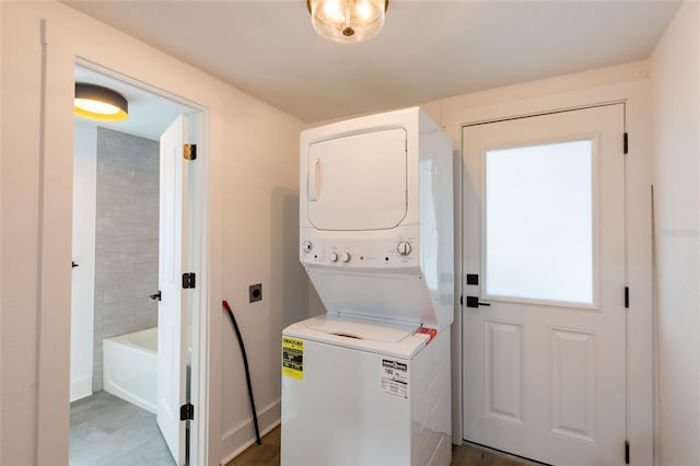 laundry room featuring stacked washer and clothes dryer