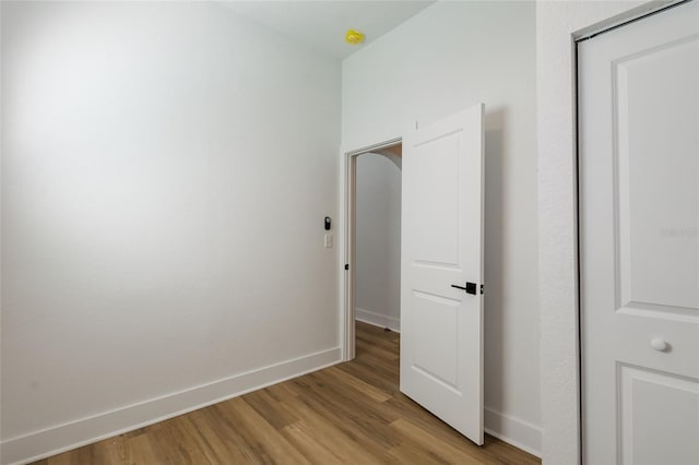 hallway with light hardwood / wood-style flooring