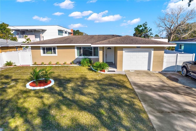 view of front facade featuring a garage and a front lawn