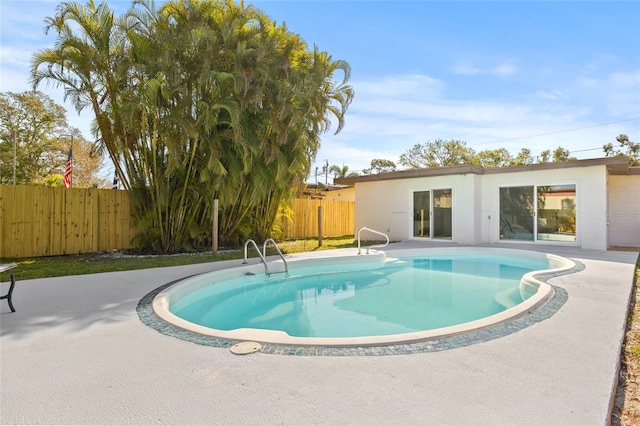 view of swimming pool with a patio