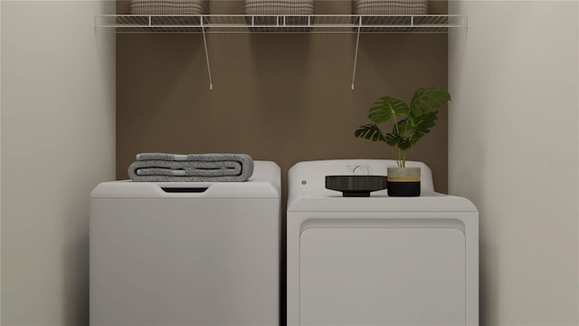 clothes washing area featuring independent washer and dryer