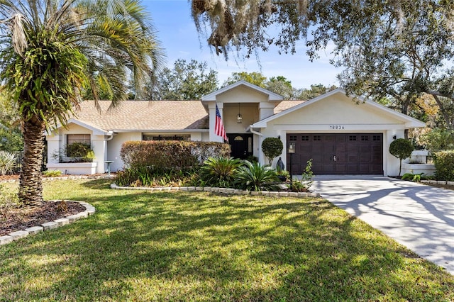 view of front facade featuring a garage and a front yard