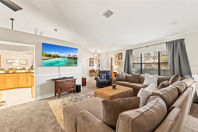 living room featuring vaulted ceiling and light colored carpet