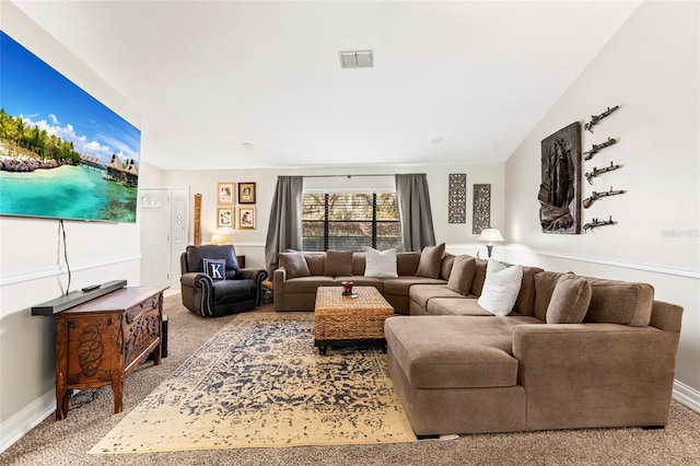 living room with lofted ceiling and light carpet