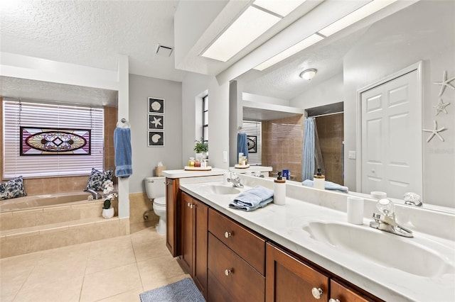 full bathroom with shower with separate bathtub, tile patterned flooring, vanity, toilet, and a textured ceiling