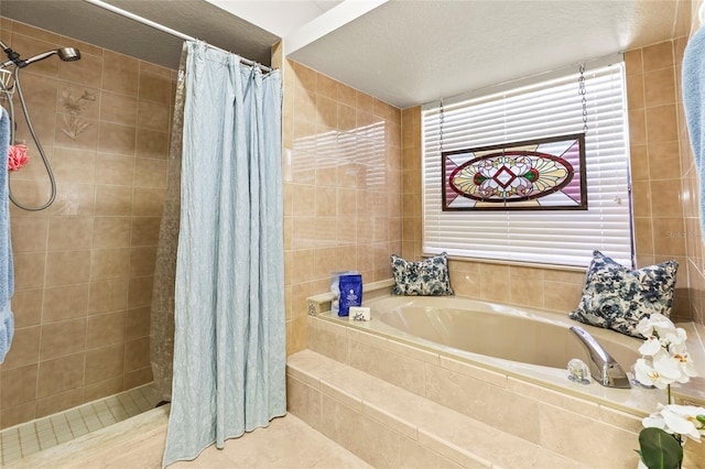 bathroom featuring tile walls, a textured ceiling, and separate shower and tub