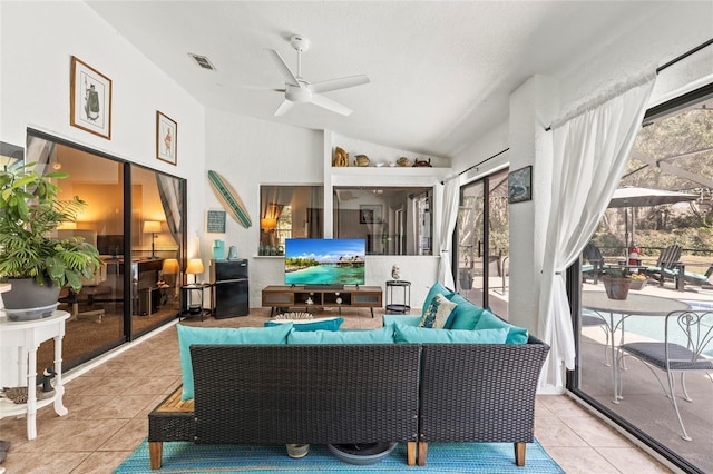 sunroom / solarium with ceiling fan and vaulted ceiling