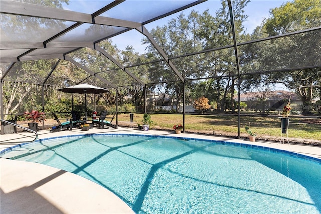 view of pool featuring a patio and glass enclosure