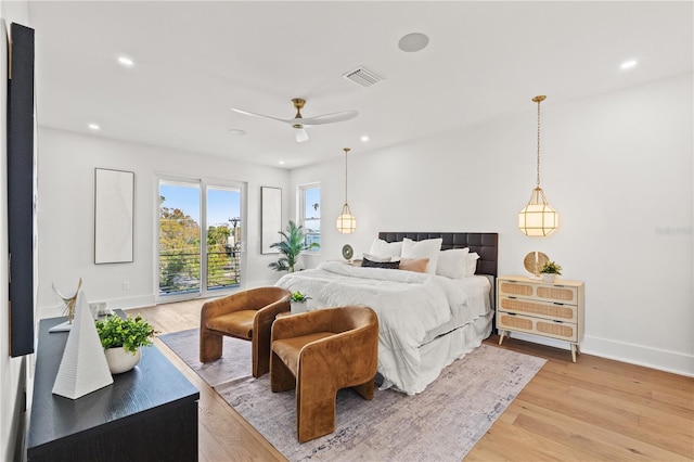 bedroom with access to exterior, recessed lighting, visible vents, and light wood-style flooring