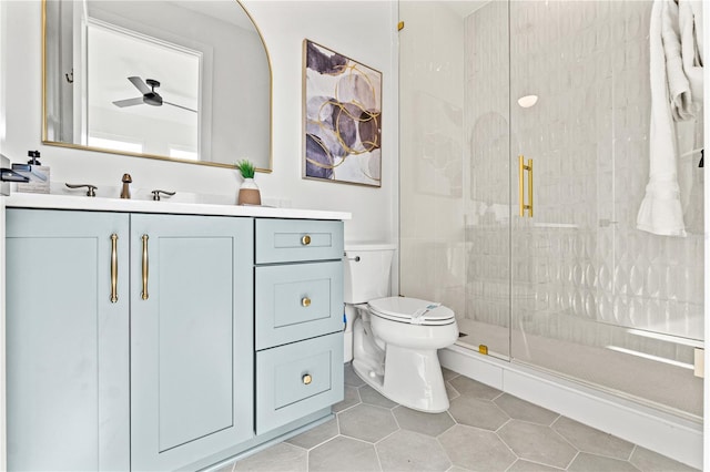 full bath with toilet, a stall shower, tile patterned flooring, and vanity